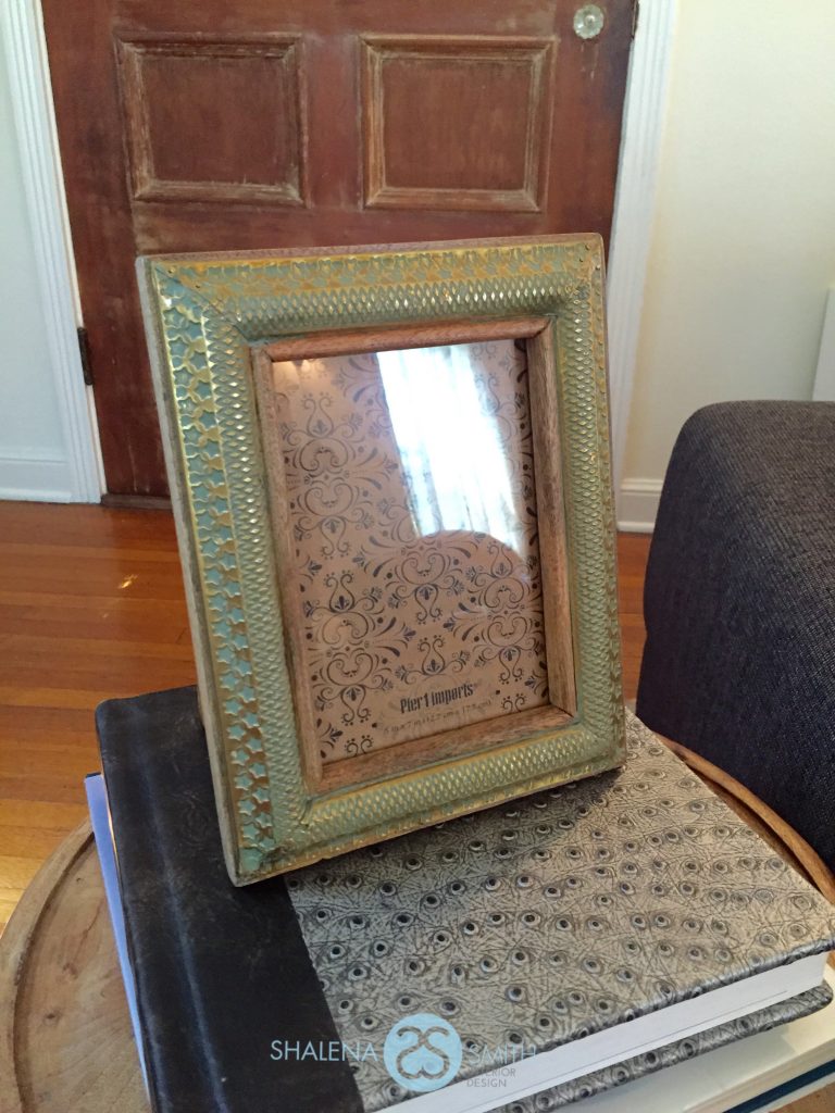 So simple and easy to do. This picture frame added some height to the side table and tied in our color.